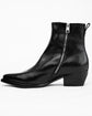 A black leather ankle boot with a side zipper, low block heel, and pull tab, shown from a side profile on a white background.