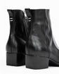 Black leather ankle boots with a side zipper and block heel, shown from a rear three-quarter angle on a white background.
