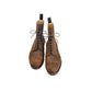 Pair of brown leather boots on a white background