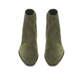 A pair of olive green suede ankle boots with pointed toes and side zippers, shown from a top-down view on a white background.