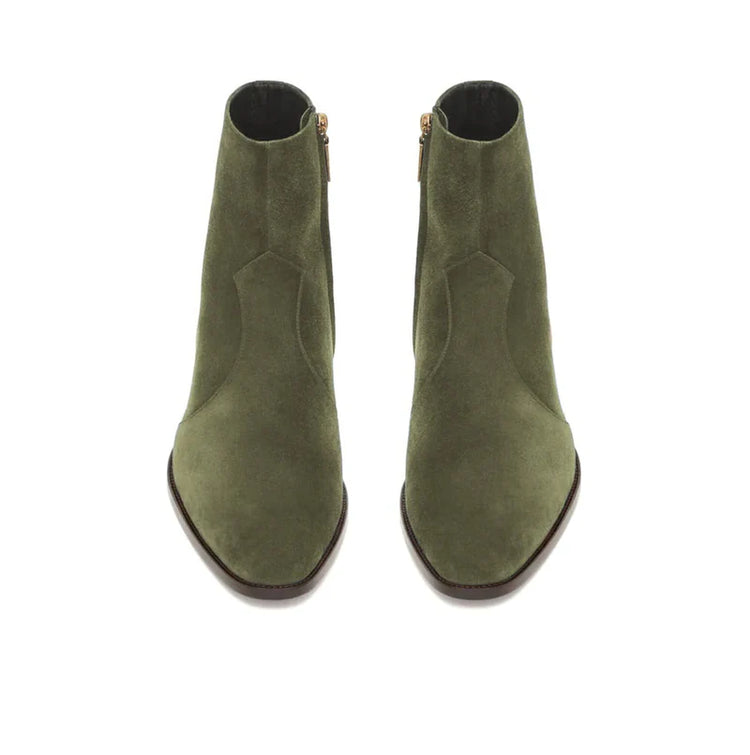 A pair of olive green suede ankle boots with pointed toes and side zippers, shown from a top-down view on a white background.