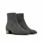 Pair of gray ankle boots on a white background