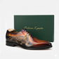 Brown leather shoe with intricate design on a white background, featuring 'Italiana X quisto' branding.