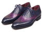 A pair of men's wingtip oxford shoes featuring a dark navy blue and purple gradient finish on the leather, with matching navy laces and a dark sole, shown against a plain white background.