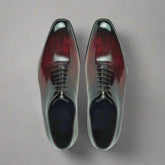 Pair of polished dress shoes on a white background