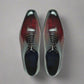 Pair of polished dress shoes on a white background