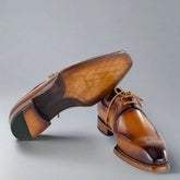 Brown leather dress shoes on a white background