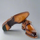Brown leather dress shoes on a white background